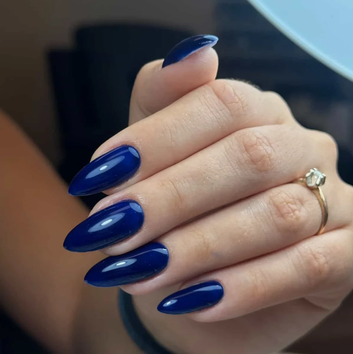 Glossy navy almond nails